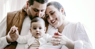 Ashli Brown with her husband and daughter.