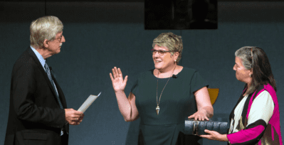 National Institutes of Health Director Francis S. Collins, M.D., Ph.D., swears in Patricia Flatley Brennan, R.N., Ph.D., as the 19th director of NLM.