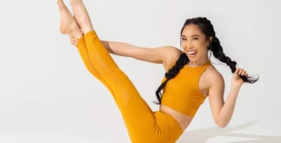 Casey Ho demonstrating a yoga position.