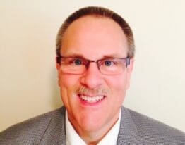 Headshot of Gregory Scott.