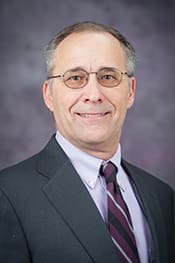 Headshot of Ed Brokesh.